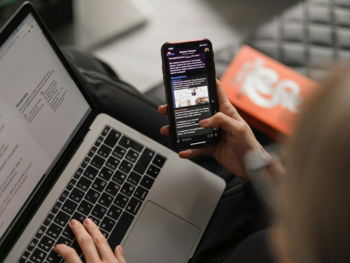 person holding black iphone 4