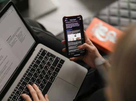 person holding black iphone 4